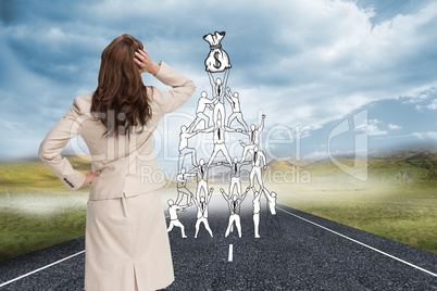 Composite image of businesswoman standing back to camera with ha