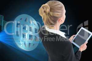 Composite image of businesswoman holding tablet