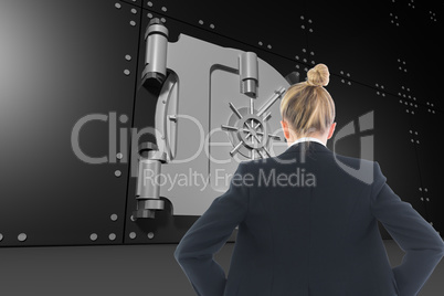 Composite image of businesswoman standing with hands on hips Composite image of businesswoman standing with hands on hips