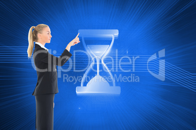 Composite image of businesswoman pointing somewhere