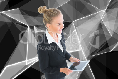 Composite image of businesswoman holding new tablet