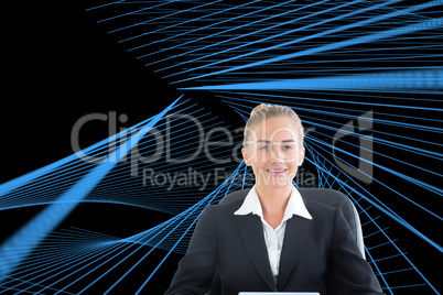 Composite image of businesswoman sitting on swivel chair with ta