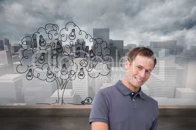Composite image of smiling young man with tablet computer Composite image of smiling young man with tablet computer