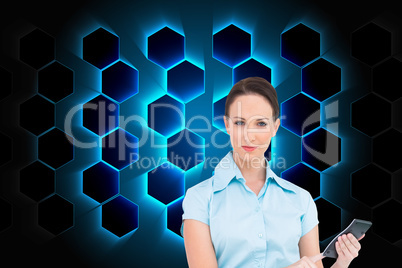 Composite image of serious classy businesswoman using calculator