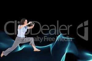 Composite image of cheerful classy businesswoman jumping while h