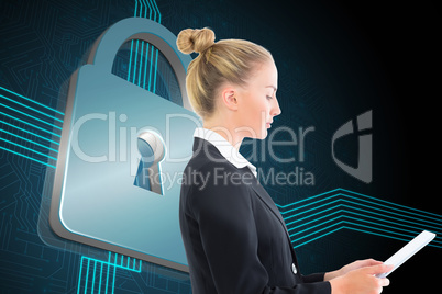 Composite image of businesswoman holding tablet