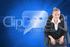 Composite image of businesswoman sitting on swivel chair with la