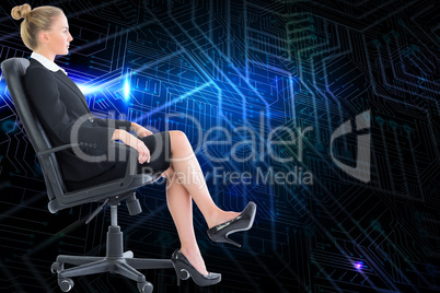 Composite image of businesswoman sitting on swivel chair in blac