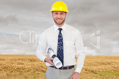 Composite image of cheerful young architect posing