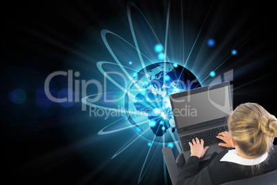 Composite image of businesswoman sitting on swivel chair with la