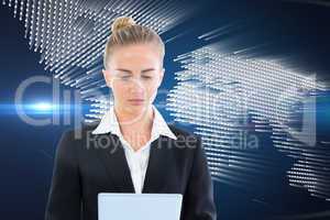 Composite image of businesswoman holding tablet