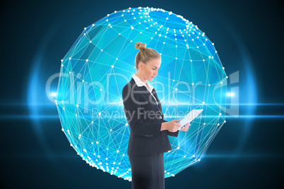 Composite image of businesswoman holding new tablet