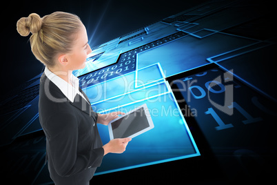 Composite image of businesswoman holding new tablet