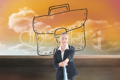 Composite image of businesswoman pulling a rope