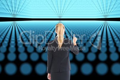 Composite image of businesswoman pointing somewhere