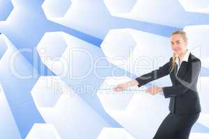 Composite image of businesswoman pulling a rope