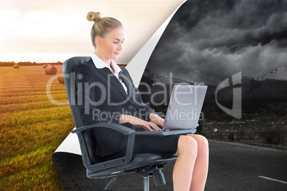 Composite image of businesswoman sitting on swivel chair with la