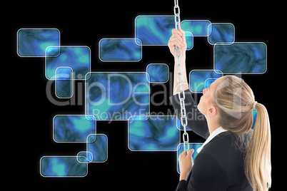 Composite image of businesswoman pulling a chain