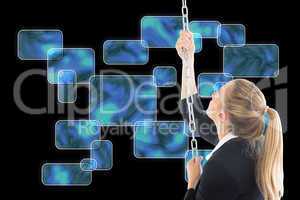 Composite image of businesswoman pulling a chain