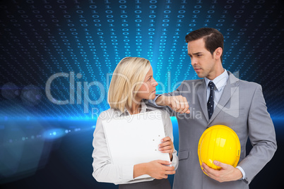 Composite image of architects with plans and hard hat looking at