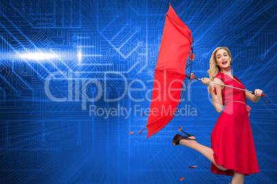 Composite image of elegant blonde holding umbrella