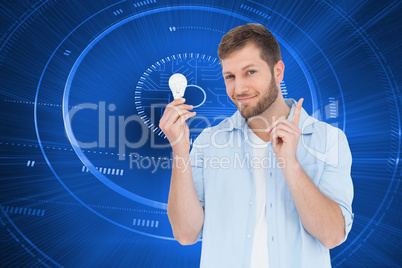 Composite image of charming model holding a bulb in right hand