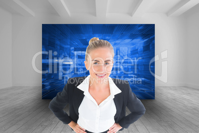 Composite image of businesswoman standing with hands on hips