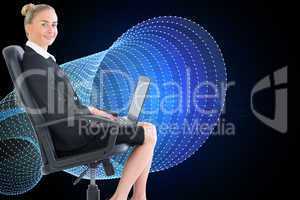 Composite image of businesswoman sitting on swivel chair with la