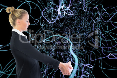 Composite image of businesswoman holding piggy bank