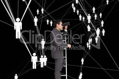 Composite image of businessman standing on ladder