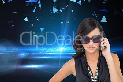 Composite image of serious elegant brunette wearing sunglasses o