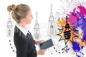 Composite image of businesswoman holding tablet