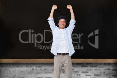 Composite image of cheering male with arms up