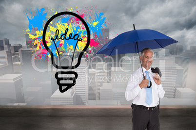 Composite image of happy businessman holding umbrella Composite image of happy businessman holding umbrella
