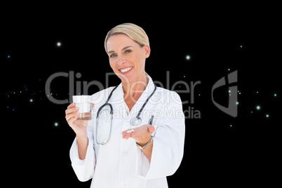 Composite image of happy doctor holding out pills and water glas