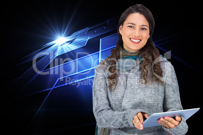 Composite image of smiling model wearing winter clothes holding