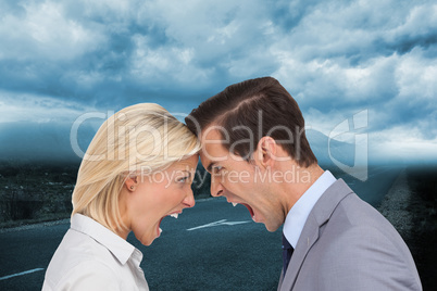 Composite image of colleagues quarreling head against head