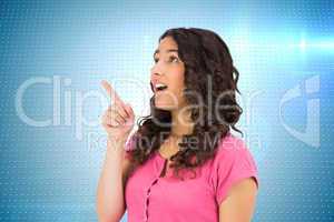 Composite image of surprised brown haired woman pointing out