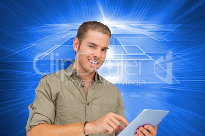 Composite image of happy man using tablet pc