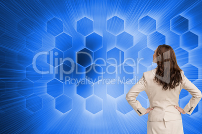 Composite image of businesswoman standing back to camera