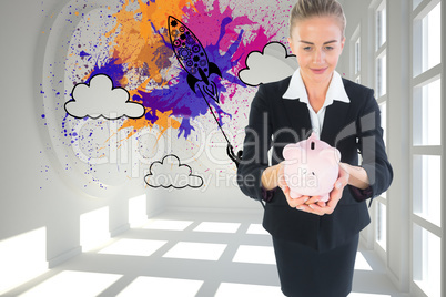 Composite image of businesswoman holding pink piggy bank