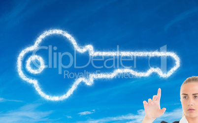 Composite image of businesswoman pointing somewhere