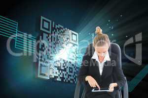 Composite image of businesswoman sitting on swivel chair with ta