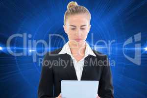 Composite image of businesswoman holding tablet