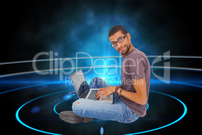 Composite image of man wearing glasses sitting on floor using la