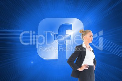 Composite image of businesswoman standing with hands on hips