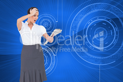 Composite image of surprised classy businesswoman holding newspa