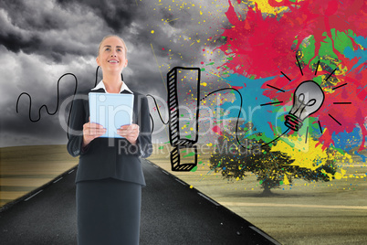 Composite image of businesswoman holding new tablet