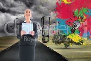 Composite image of businesswoman holding new tablet