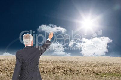 Composite image of rear view of serious businessman standing and